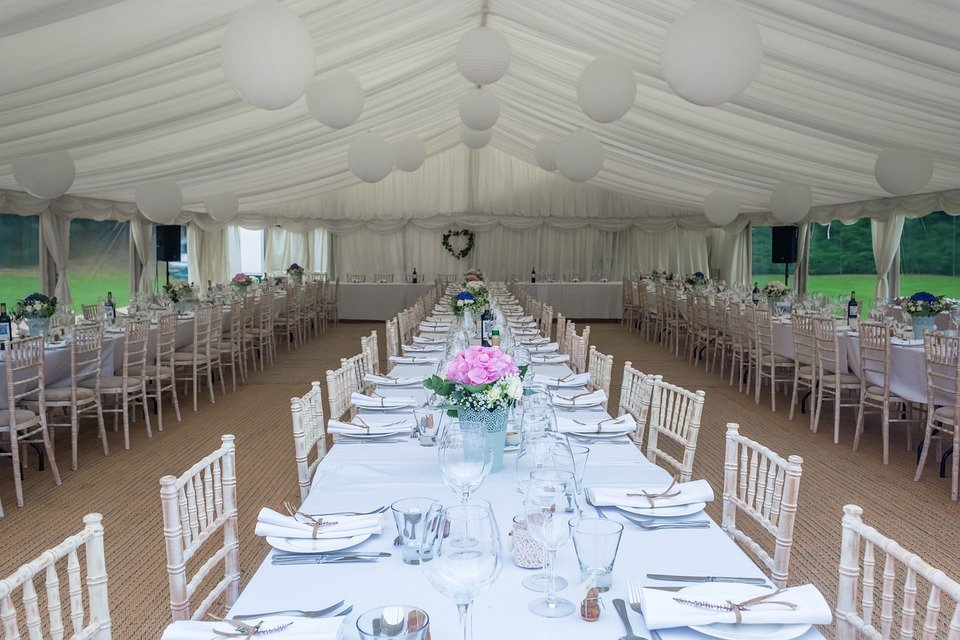 Long table dressed up inside a marquee 